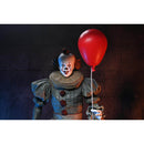 Pennywise Clown figure holding a red balloon against a dark background