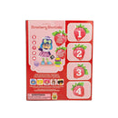The retail packaging box for 'Strawberry Shortcake' toy figures, featuring a pink and red design with illustrations of a character and numbered strawberry-themed cards.
