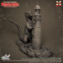 Model kit of Rhedosaurus next to a lighthouse on a textured brown background