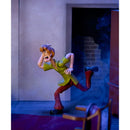 Animated character in a dynamic pose in a room with a door and chair.