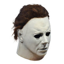 Michael Myers mask with brown hair on a white background