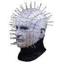 White mask with metal pins on a white background