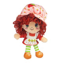 Plush toy with red hair and a strawberry-themed hat on a white background