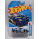 A Hot Wheels die-cast toy car of the Subaru Impreza WRX, model TRJ/350, in its original blister card packaging. The packaging features a blue and yellow car illustration and the Hot Wheels logo.