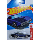A Hot Wheels Custom Otto die-cast toy car in its original blister card packaging, featuring a dark blue car with a black hood and a purple vinyl wrap, and TH letters on side of car, set against a blue and red Hot Wheels card.