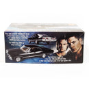 Boxed model car with promotional text and images of two men on a white background