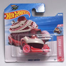 A Hot Wheels Sweet Driver toy car in its original blister card packaging, featuring a red and white cupcake-themed design with pink wheels and a white frosting-like hood.
