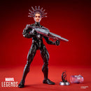 Spiderman figure with a metallic spiked helmet and a large silver gun, posed on a red background with a small accessory display piece and a clear capsule nearby.