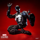 Marvel Legends Series Venom Spider-Man action figure posed mid-lunge against a dark red gradient background, with Marvel Legends Series branding and copyright text visible.