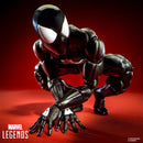 Marvel Legends Spiderman Venom action figure posed in a crouching, hands-on-ground stance against a dark red studio background.