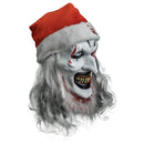 Halloween mask with red Santa hat and white face makeup on a white background