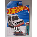Hot Wheels toy car in its original blister packaging, featuring a white and red Volkswagen Golf Mk1 with 'Tooned' livery. The cardback is blue with the classic red and yellow Hot Wheels logo.