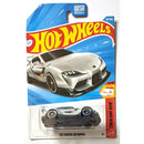 A Hot Wheels '20 Toyota GR Supra die-cast toy car in its original blister card packaging, featuring a silver and black car design on a blue and red card.