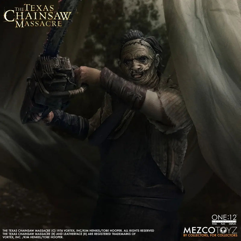 Action figure from 'The Texas Chainsaw Massacre' holding a chainsaw with Mezco Toyz branding.