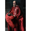 NECA Ultimate Phantom of the Opera (1925) 7-Inch Scale Action Figure (Masque of the Red Death) holding his hat and staring off with a scared look in his face