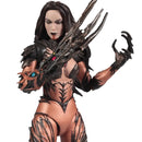 A collectible action figure of a female character with long dark hair, wearing a metallic bronze and black armored bodysuit with clawed gloves and accessories, posed against a solid white background.