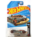 A Hot Wheels X-Steam toy car in its original blister card packaging, featuring a metallic gray and black car with copper steam pipes and a gold front bumper.