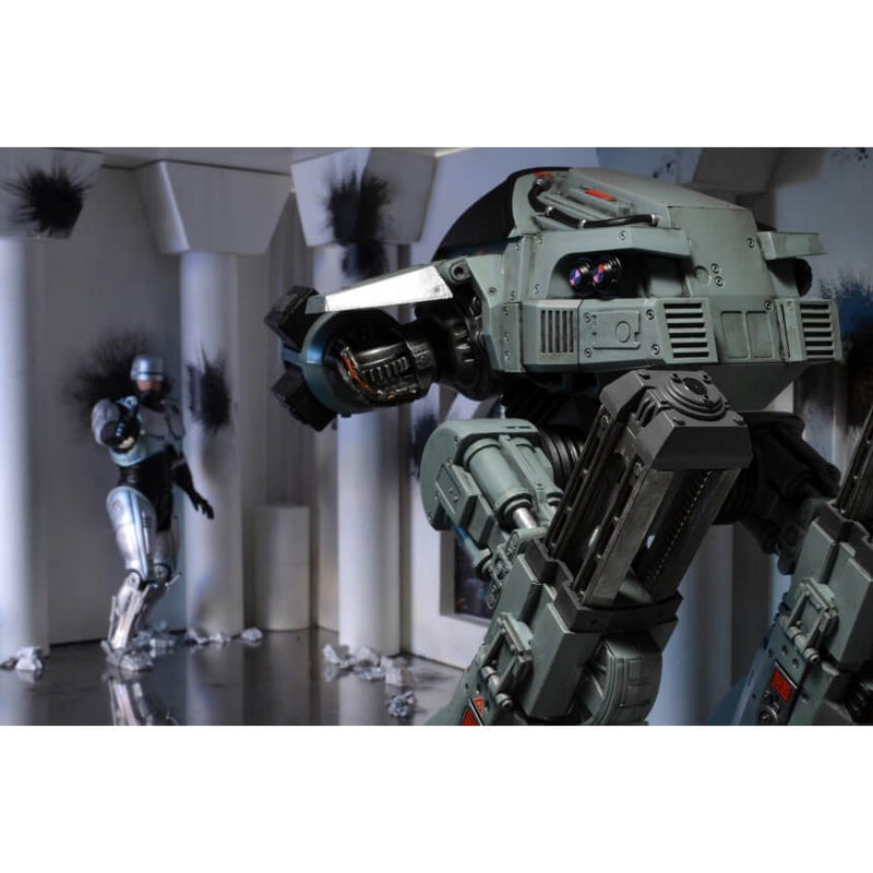  NECA Robocop ED-209 10 Inch Articulated Figure w/ Sound, rear view in diarama with Robocop