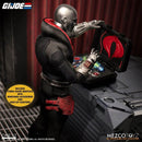 Mezco Toyz G.I. Joe Destro One:12 Collective Action Figure looking into briefcase