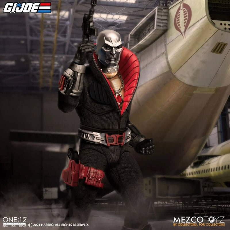 Mezco Toyz G.I. Joe Destro One:12 Collective Action Figure holding up pistol