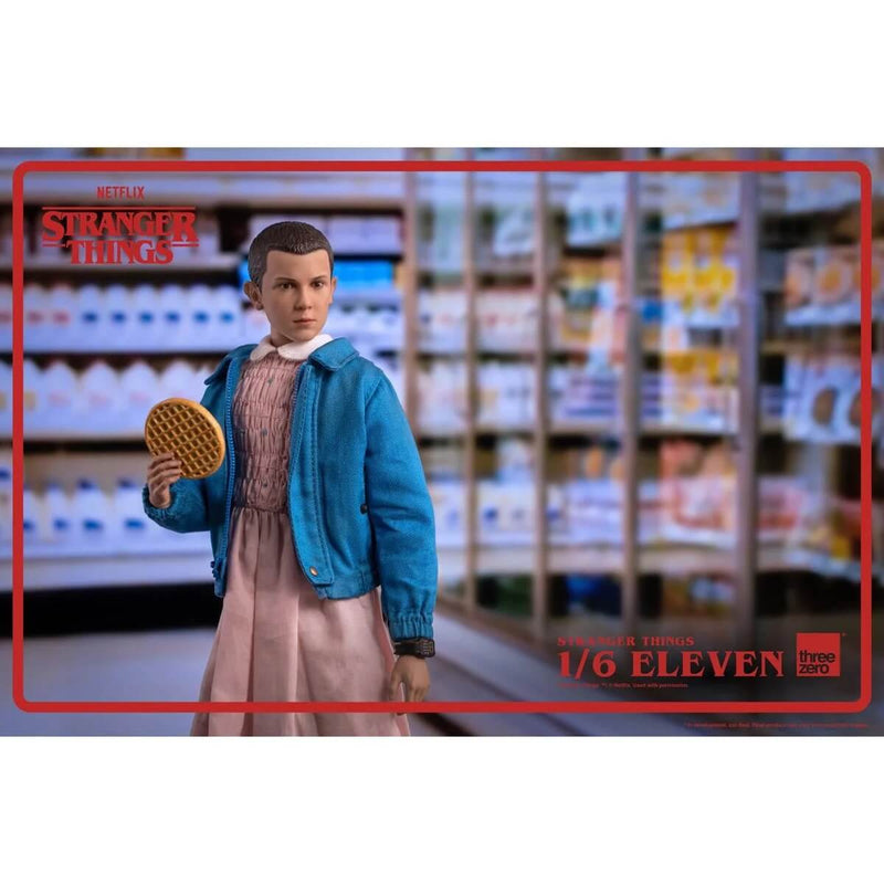 Threezero Stranger Things Eleven 1:6 Scale 9" Action Figure holding waffle