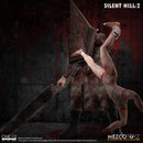 Mezco Toyz Silent Hill 2: Red Pyramid Thing One:12 Collective Action Figure holding mannequin