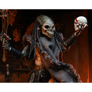 NECA Predator 2 Ultimate Shaman 7” Scale Action Figure, closeup holding up skull and staff