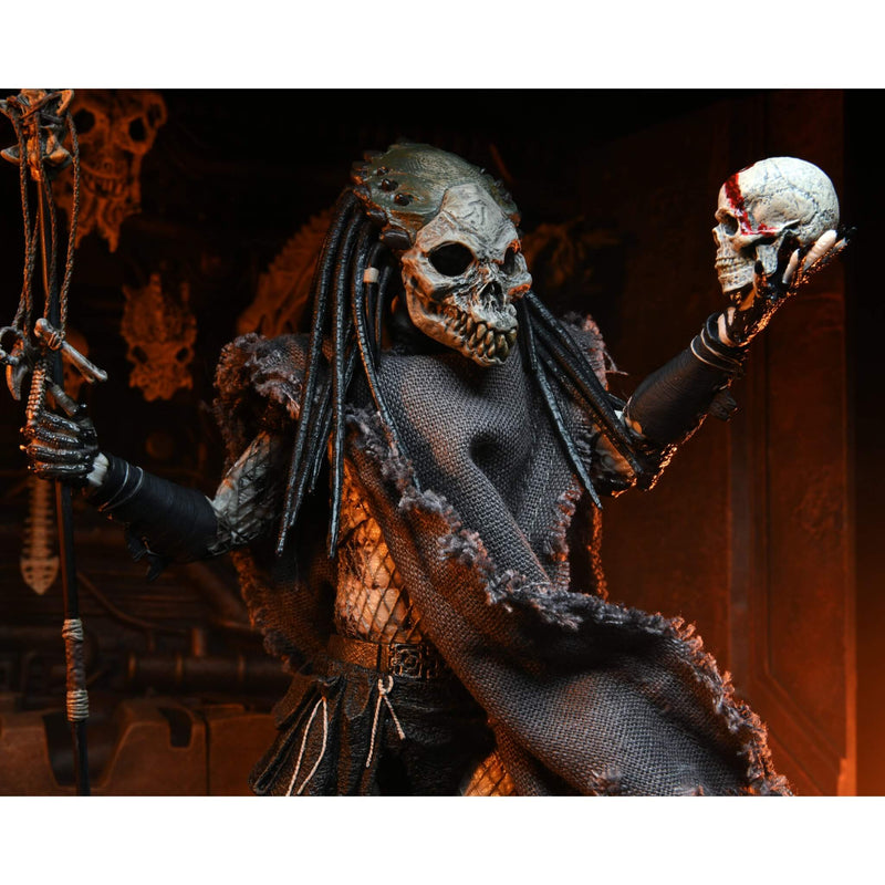 NECA Predator 2 Ultimate Shaman 7” Scale Action Figure, closeup holding up skull and staff