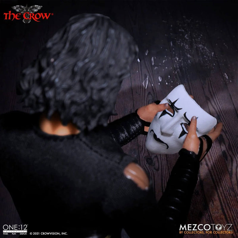 Mezco Toyz The Crow One:12 Collective 6 3/4 Inch Action Figure holding mask