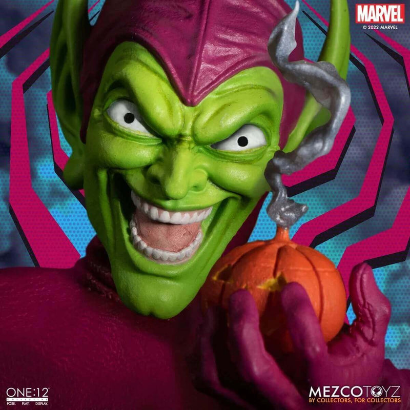 Mezco Toyz Green Goblin Deluxe Edition One:12 Collective Action Figure,  closeup of face holding pumpkin bomb